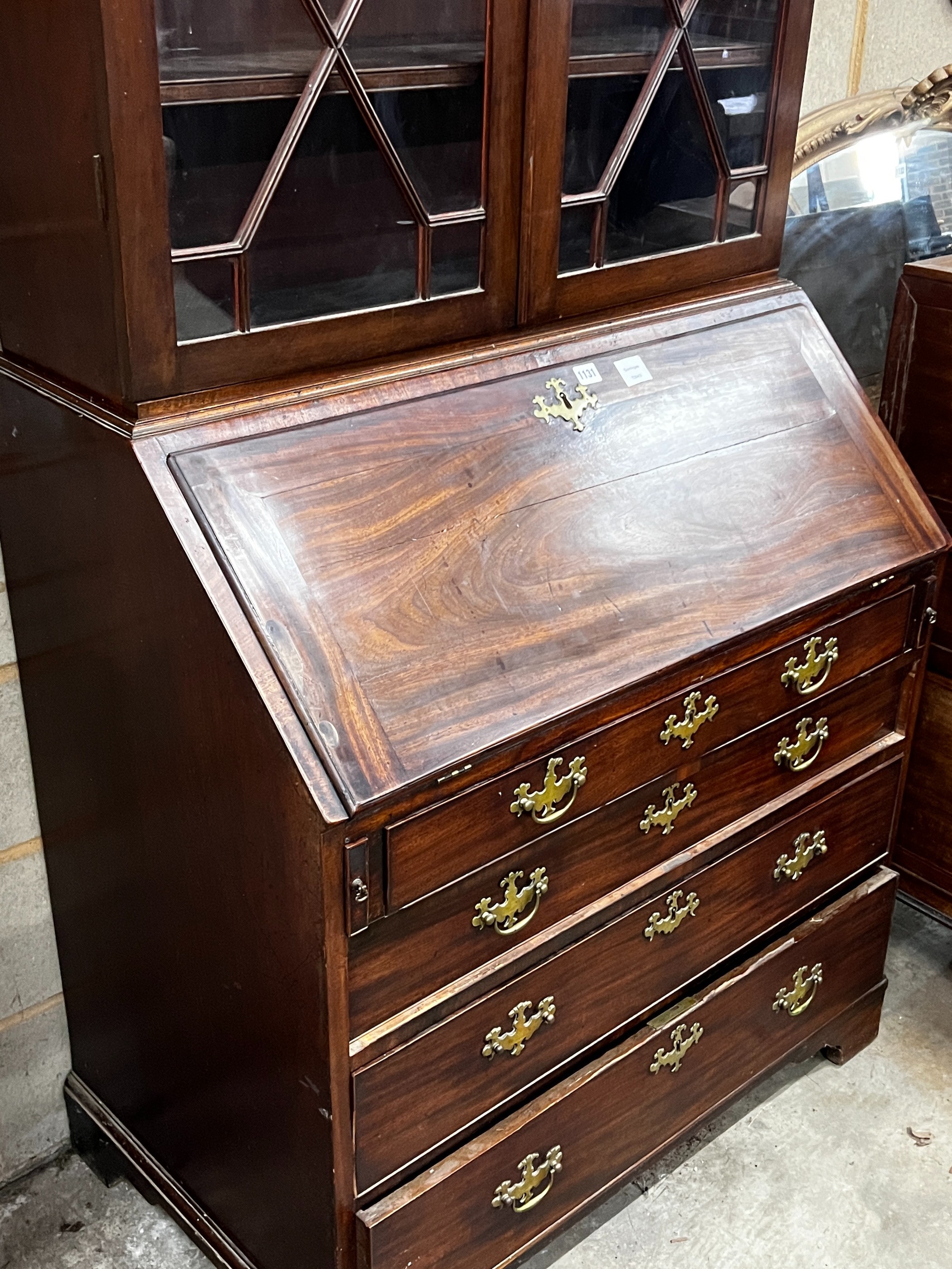 A George III mahogany bureau, with later bookcase top, width 96cm, depth 57cm, height 225cm